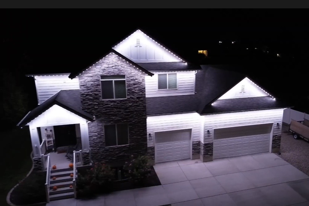 Pure White permanent roofline lighting on a home